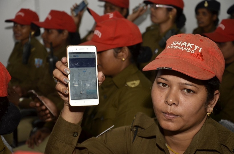 A policewoman shows Paytm app on her smartphone after undergoing a training session on cashless transactions in Ranchi on Nov 29, 2016. (Photo: IANS)